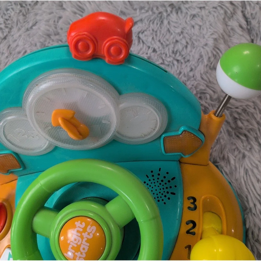 Bright Starts Lights & Colors Driver Light-Up Musical Baby Activity Toy Works